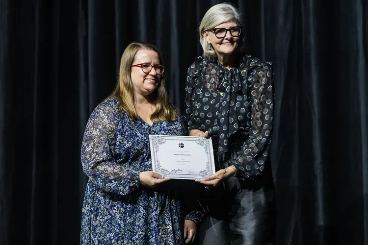 Hillary Smith receiving an award