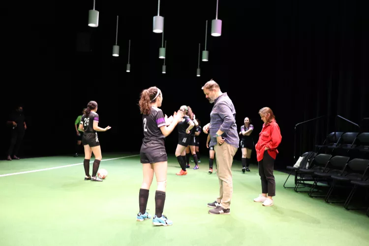 Director Alex Torra and student actors on the set of "The Wolves"