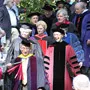 Faculty Marshall Don Shimamoto leads the procession into the Scott Outdoor Amphitheater