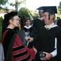 President Rebecca Chopp shakes hands