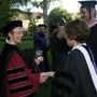 President Rebecca Chopp shakes hands