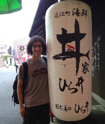Student posing outside of Japanese restaurant