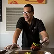 Donny Thomas serves food