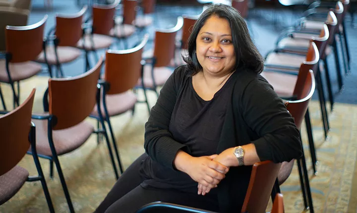 Nafisa Essop Sheik sitting in front of chairs