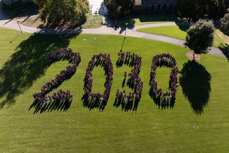 Class of 2030 forms "2030" on outdoor lawn