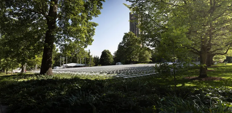 Rows of white chairs on Parrish Lawn