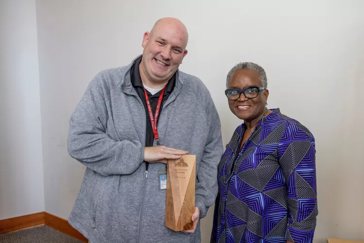 Bob Steveline accepts Greg Brown Award with President Val Smith nearby