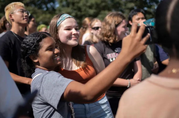 Two students pose for a selfie