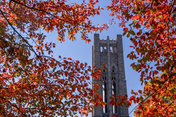 Clothier Belltower surrounded by red and orange leaves