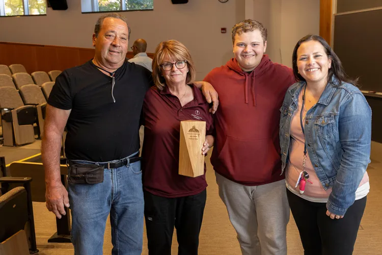 Anne Dortone poses with family members