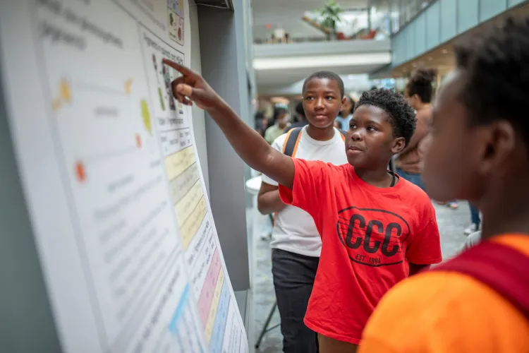 Student presents poster at CCC summer camp