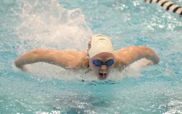 Anne Miller swims butterfly stroke