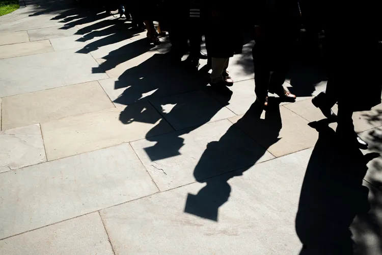 Shadow of graduates walking