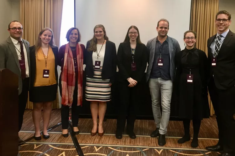 Karina Cooper ’20 (fourth from right), Rebecca Posner-Hess ’21 (second from right), and Associate Professor of Classics Jeremy Lefkowitz (third from right) at the conference of the Classical Association of the Atlantic States (CAAS)