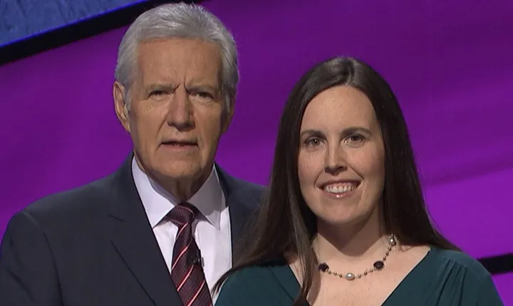 Alex Trebek stands with Emily Frey