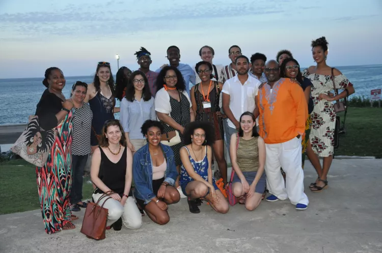 group shot of students and staff on beach in Cuba