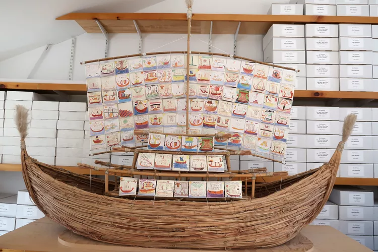 Ship made of wood with pictures of boats