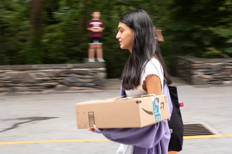 Student carries box