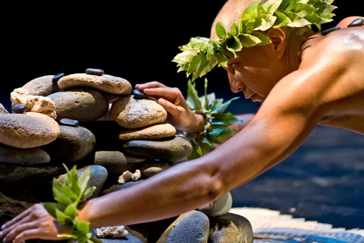 Man stacks stones for exhibit
