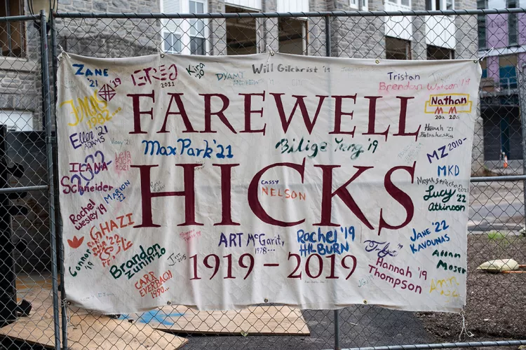 "Farewell Hicks Hall" hangs on fence outside of Hicks