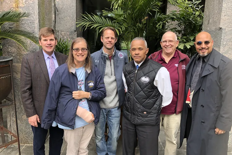 Members of Veterans at Swarthmore stand outside Kohlberg Hall