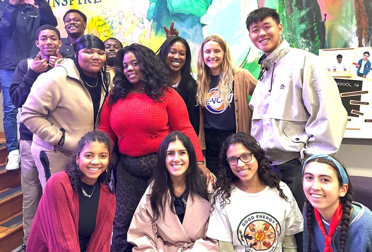 Group of individuals celebrate a ribbon cutting