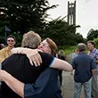 Reunited classmates hug during Alumni Weekend