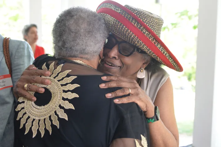 two people hug at black studies event