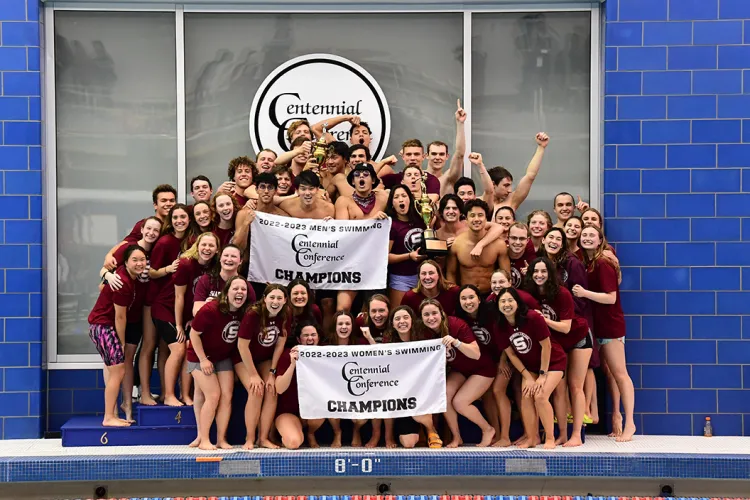 Men's and women's swim teams on championship podium