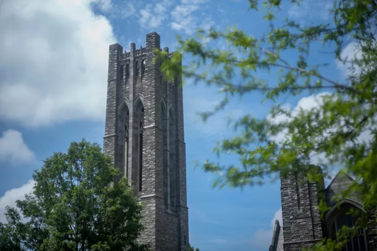 Clothier tower behind trees in spring time