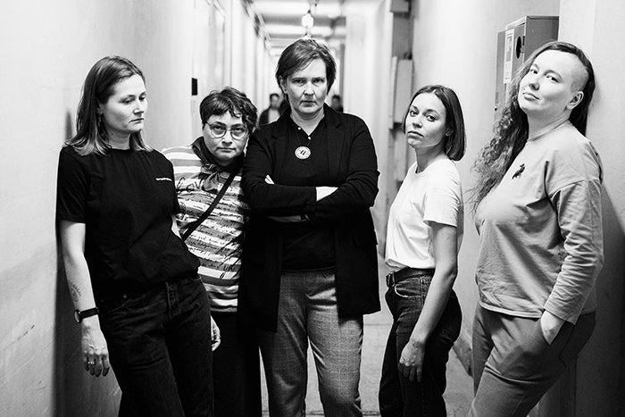 Five Russian authors pose together in black and white photo