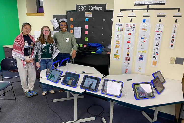 Group of students pose with iPads 