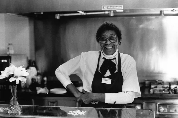 Essie Mae Burkhalter at grill in cafe named in her honor