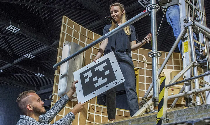 Greta Studier '19 holds 2-dimensional QR Code