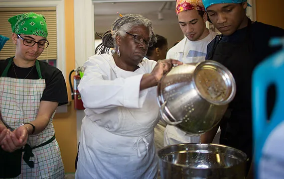 Students preparing food with chef Valerie Erwin