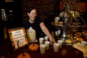 Cider is served at the 2012 Harvest Dinner