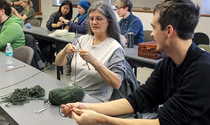 Students learning to knit