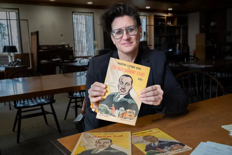 Person sitting down holds comic book about MLK