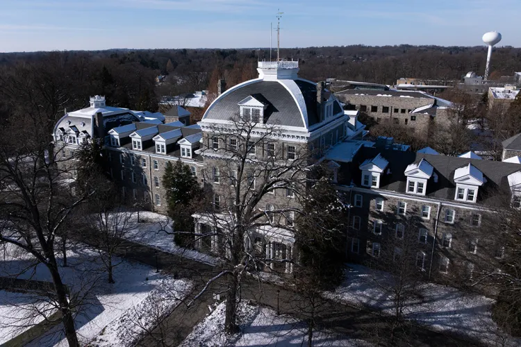 Parrish Hall drone shot in winter after light snow