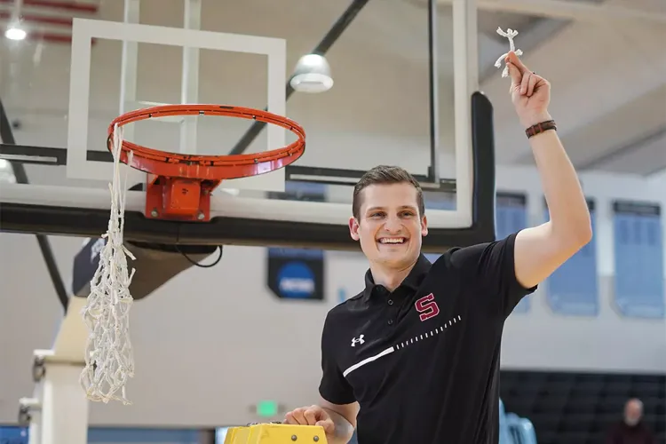 Shane Loeffler cuts off nets after winning conference title