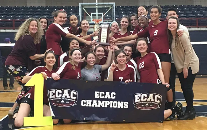 Garnet Volleyball post with their championship trophy