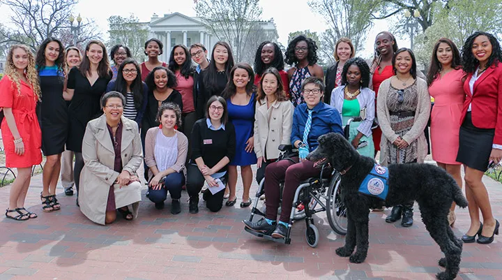 Students, faculty, and staff pose for a picture