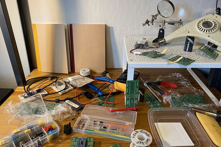 Soldering kit with supplies photographed on a desk