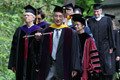 Faculty Marshall Don Shimamoto leads the processional into the amphitheater.