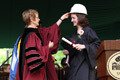 Every recipient of a B.S. degree also received a hard hat from President Rebecca Chopp.
