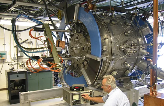 Technician working on a Magnetic Reconnection Experiment (MRX)