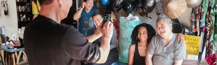 Black woman poses with her Chinese host family