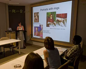 A student presents slides in Art History