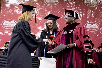 Ann Sinclair receives award from President Smith