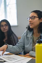 Students discuss readings during class.